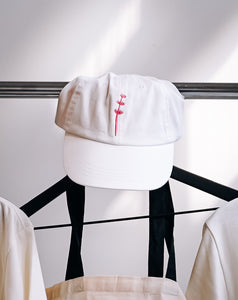 Nabati white hat with pink logo